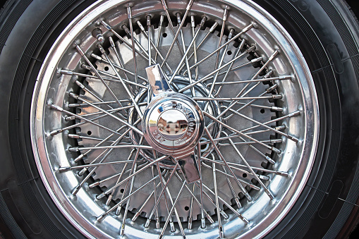 Classic chrome wire wheel with black tire