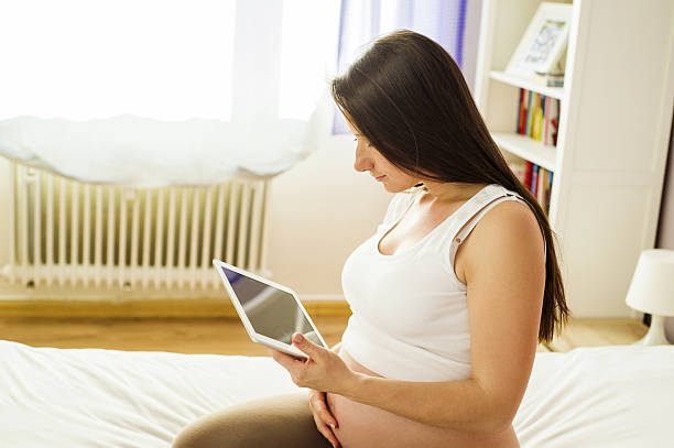 istock Pregnant woman at home 498171055