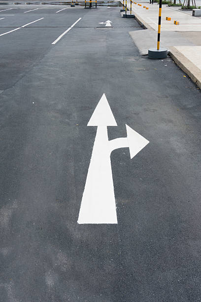 istock traffic sign go Straight on or Turn right in water 498171537