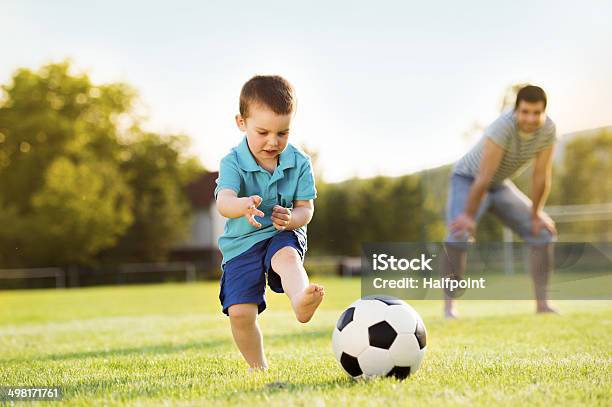 Father And Son Playing Football Stock Photo - Download Image Now - Soccer, Father, Son