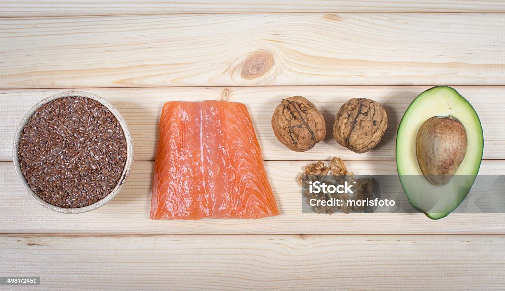 Sources of omega 3 fatty acids Sources of omega 3 fatty acids: flaxseeds, avocado, salmon and walnuts 2015 Stock Photo