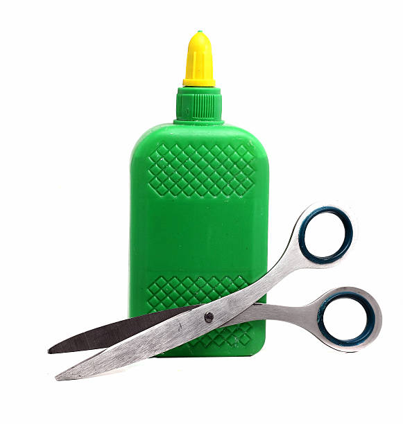 istock bottle of glue and scissors on a white background 498172912