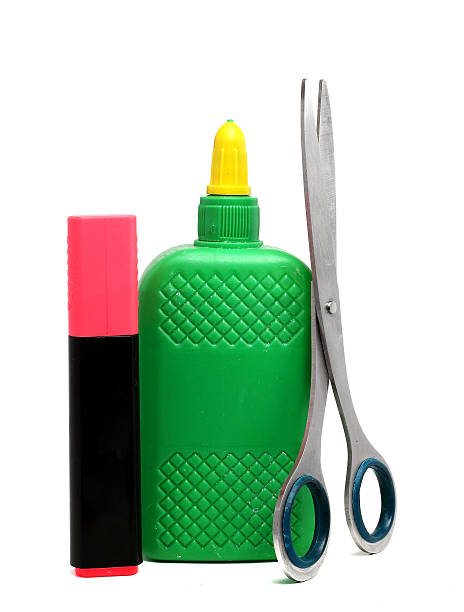 istock bottle of glue, scissors and a pink marker 498172958