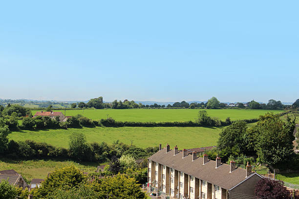 istock Countryside view with row of modern houses / rooftops, workers cottages 498173355