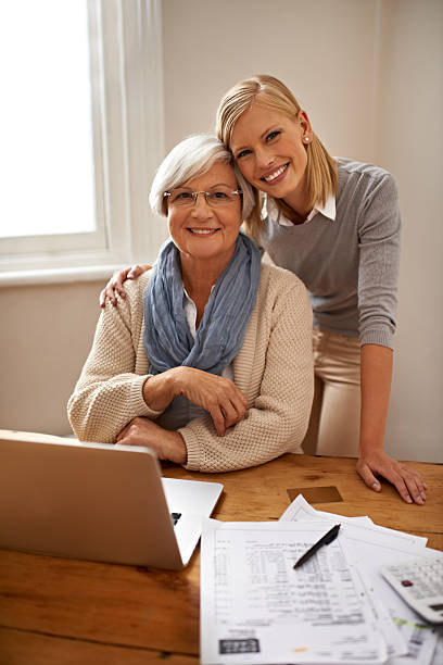 istock Helping her grandmother make sense of any financial problem 498173687