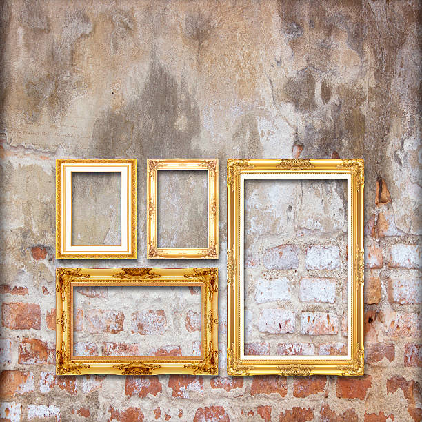 istock gold antique picture frame on the old brick wall background 498174041