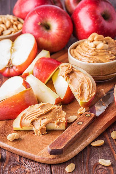 istock Red apples and peanut butter for snack 498175092