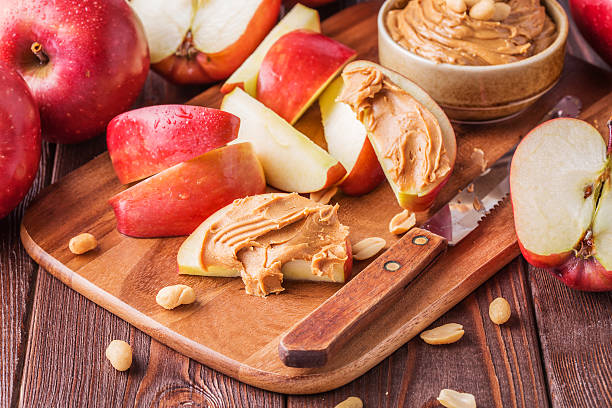 istock Red apples and peanut butter for snack 498175148