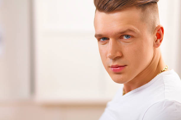 istock Young businessman working in office, sitting near desk 498188630