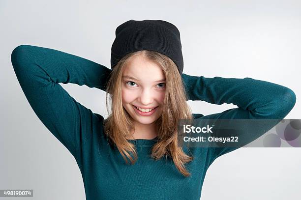 Cute Little Girl Holds Hands Behind Head Stock Photo - Download Image Now - Teenage Girls, 14-15 Years, Girls