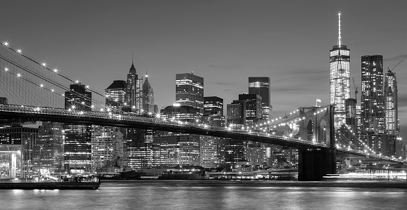 Black and white Manhattan waterfront at night, New York City, USA.