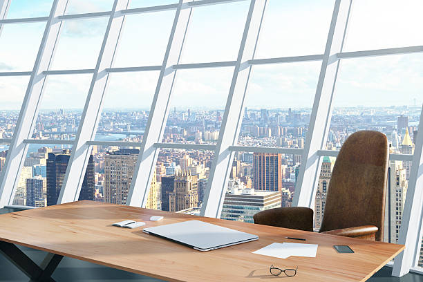 istock Light office with a table and chair and city view 498195604