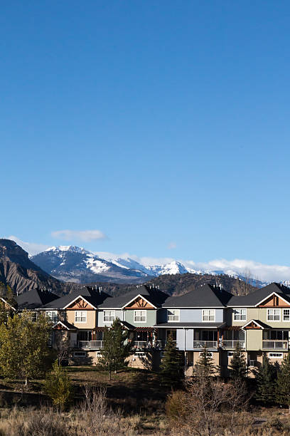 istock Row houses and snowcapped mountains 498195616