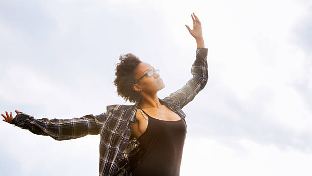 istock Beautiful black female student practicing dance outdoors 498196288
