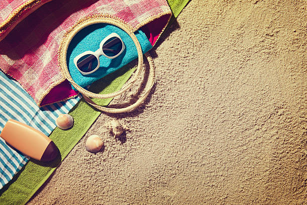 istock Top view of sandy beach with summer accessories. 498196730