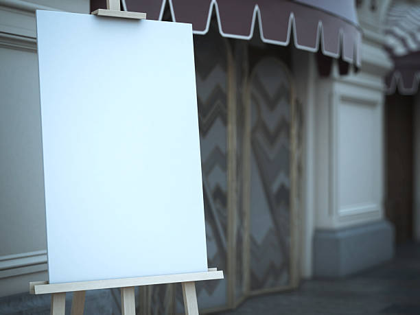 istock Wooden easel with a blank canvas near cafe. 498197548