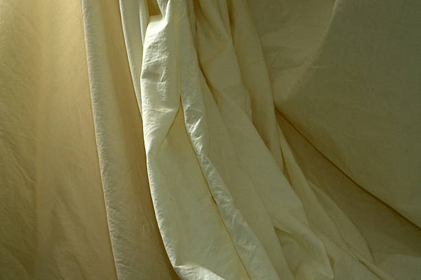 istock draped muslin background cloth with folds 498198422