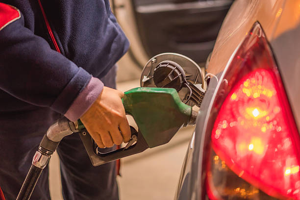 istock Buying petrol pumping gas global warming car 498199400