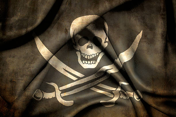 Pirate flag Pirate flag made of rough grainy textile pirate flag stock pictures, royalty-free photos & images