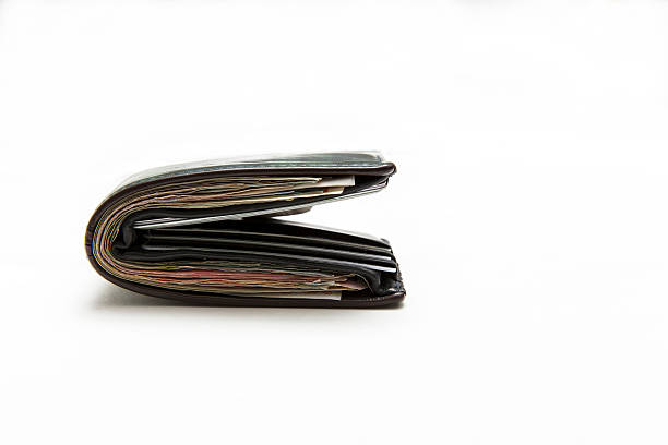 istock Wallet full of money on background 498201158
