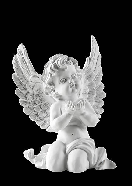 istock Little white guardian angel isolated on black background 498201186