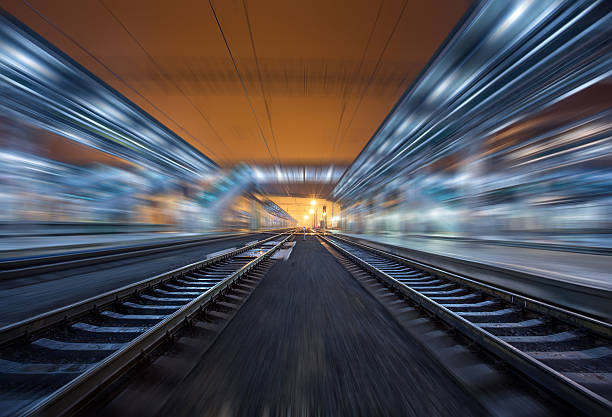 istock Railway station at night with motion blur effect. Railroad 498201666