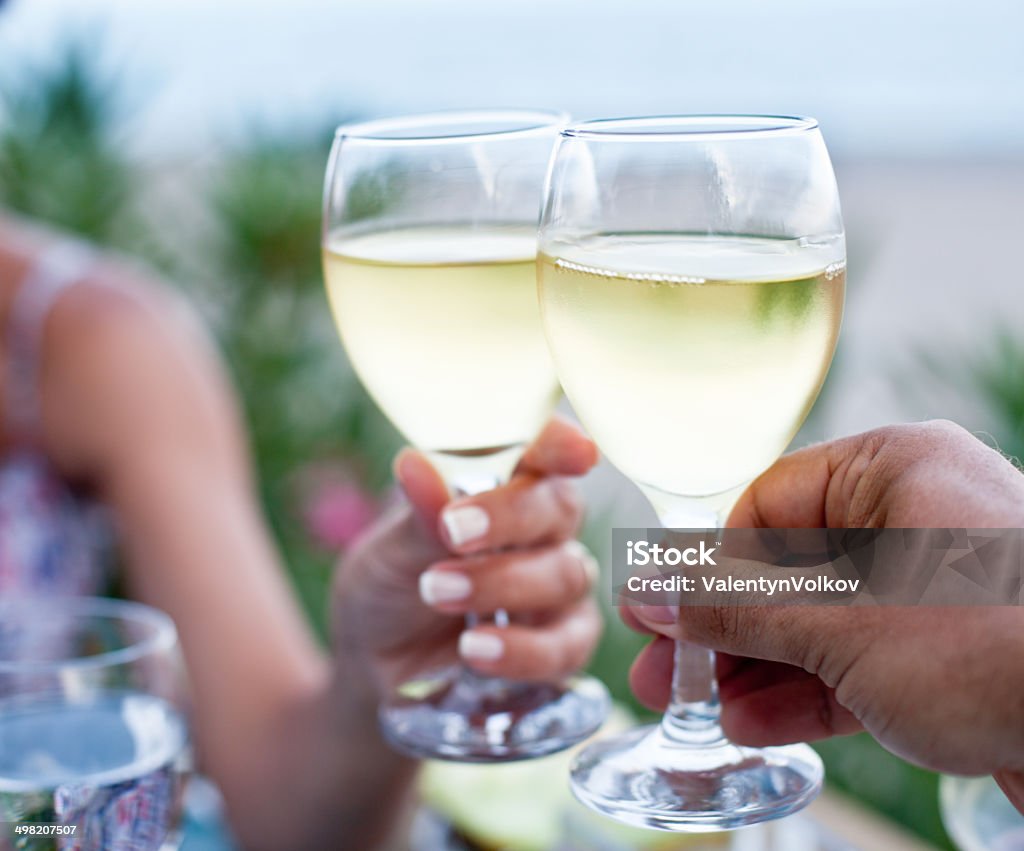 Toast for two to the sea. Toast for two to the sea during dinner. White Wine Stock Photo