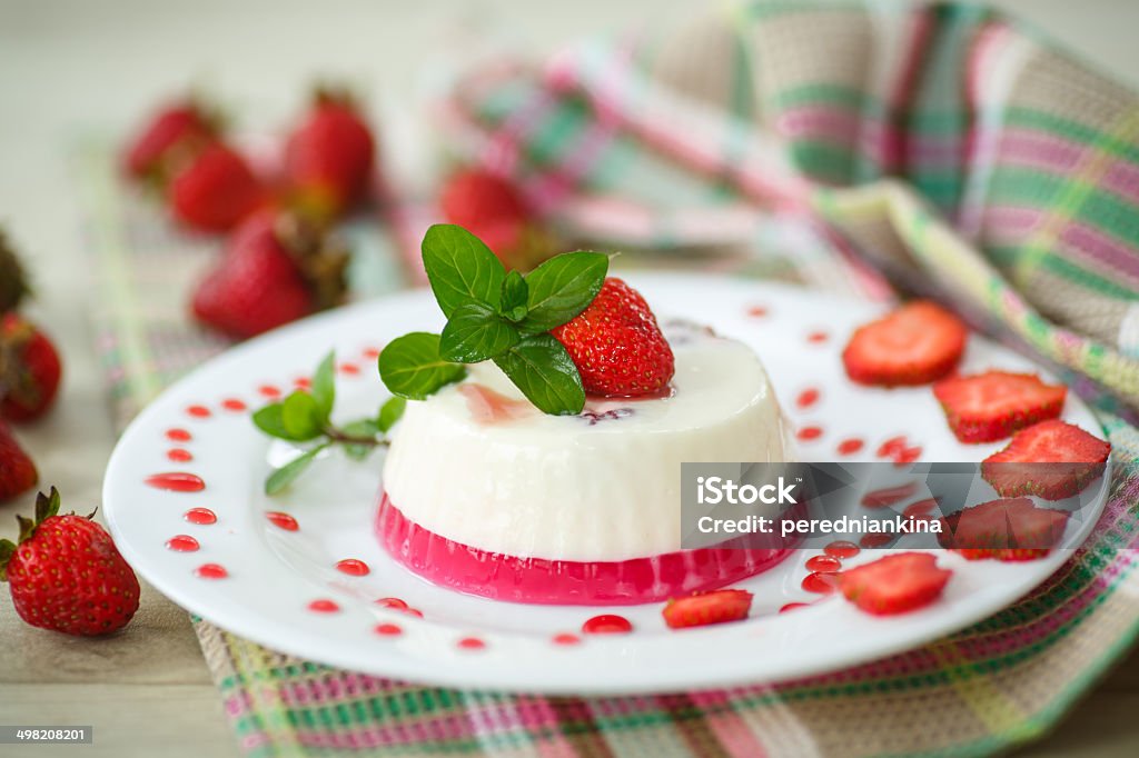 milk with strawberry jelly milk with strawberry jelly in glasses on a wooden table Backgrounds Stock Photo