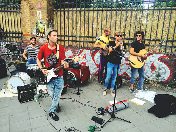 Street performance. Berlin Berlin, Germany - June 15, 2014: Street performance on the Berlin's streets. Musicians perfoming jazz music near the Mauer park. mauer park stock pictures, royalty-free photos & images