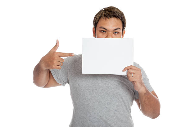 istock Asian strong man point to a blank sign 498211857