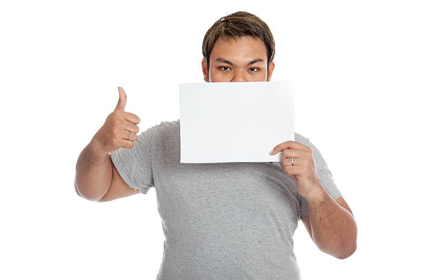 istock Asian strong man thumbs up show a blank sign 498211863