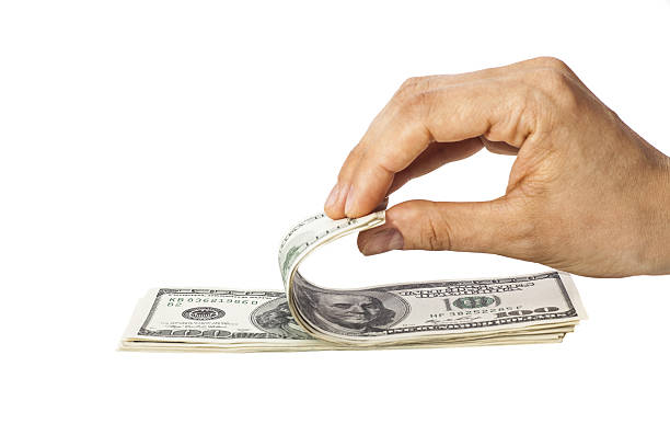 istock Woman recounts dollars 498211915