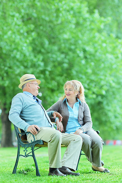 istock Mature couple having a conversation in park 498212901