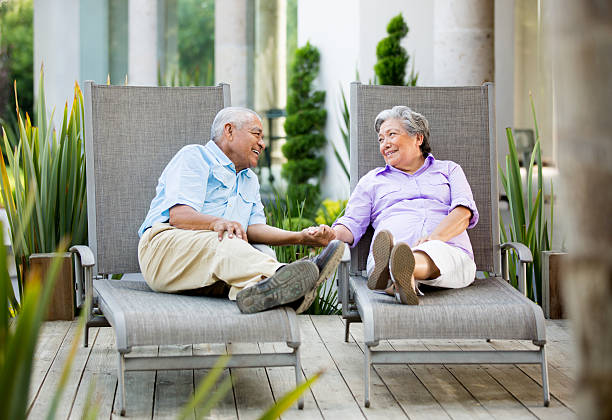 istock Latin senior couple talking together 498239251