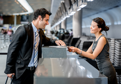 Business man traveling and doing check-in at the airport