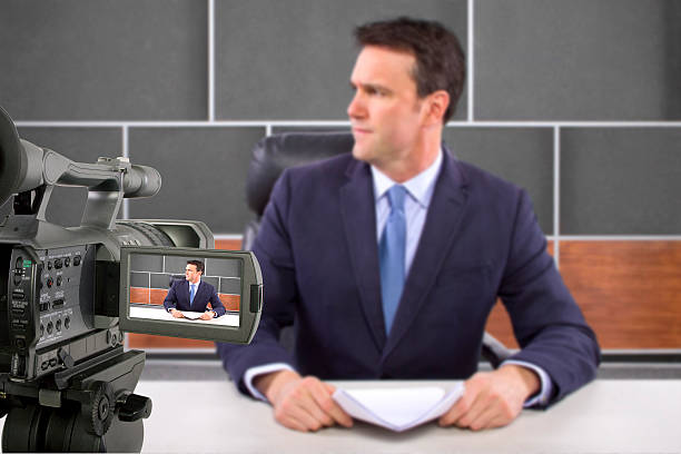 istock Camera Filming a Reporter or Anchorman in a Studio 498241599
