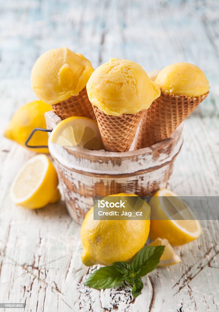 Fresh ice cream scoops in cones on wood Studio photo of ice cream scoops in waffle cones. Served on wooden planks Backgrounds Stock Photo