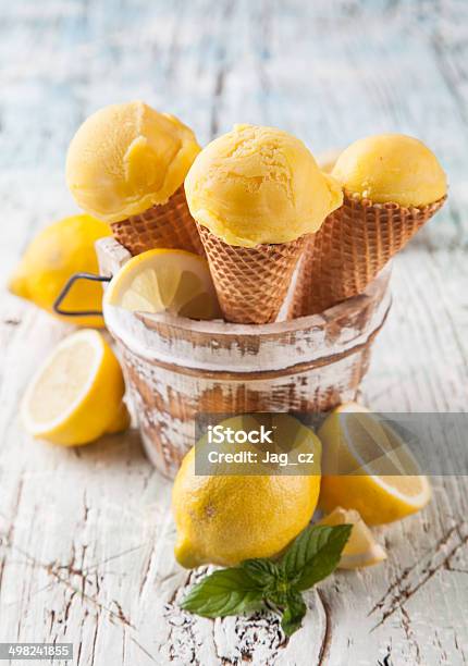 Fresh Ice Cream Scoops In Cones On Wood Stock Photo - Download Image Now - Backgrounds, Blue, Citrus Fruit