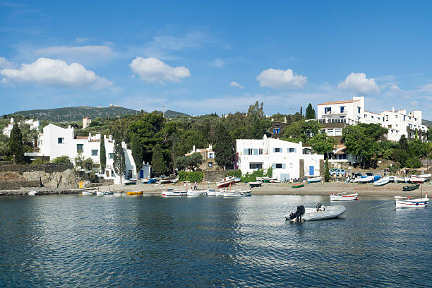 View of the beach and some white houses in the coastal town of  Port Lligat, and Dali's house in Portlligat, Cadaques, Spain.