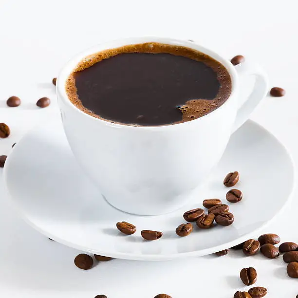 Photo of natural black coffee in a white cup