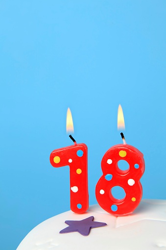 Red Birthday candles against blue background
