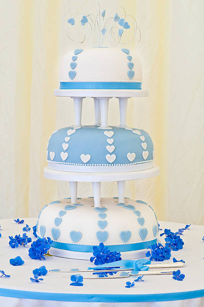 Impressive Blue and White 3 Tier Wedding Cake Picture of an Impressive Blue and White 3 Tier Wedding Cake wedding cake close up macro stock pictures, royalty-free photos & images