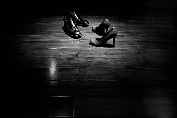 Photo of Couple shoes on dance floor in black and white