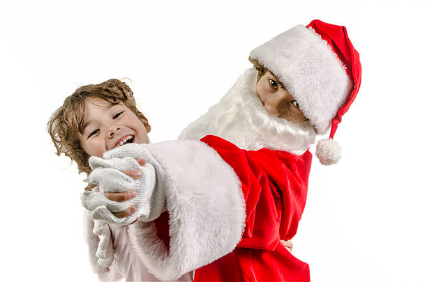 istock Little Boy disguised as Santa dancing with his sister 498246518
