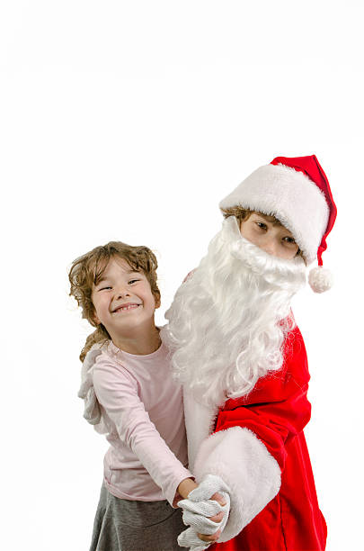 istock Little Boy disguised as Santa dancing with his sister 498246614
