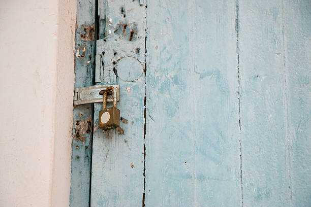 istock Old padlock on a wooden door. 498246930