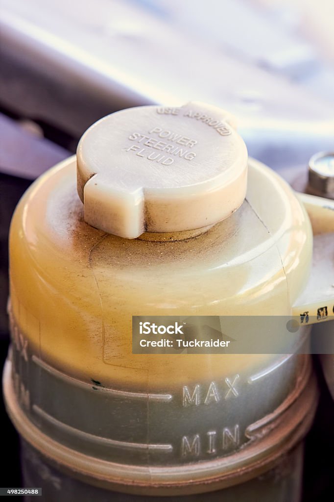 Container of power steering fluid for car 2015 Stock Photo