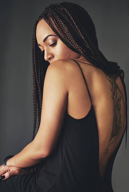Studio shot of a beautiful young woman posing against a gray backgroundhttp://195.154.178.81/DATA/i_collage/pi/shoots/805928.jpg