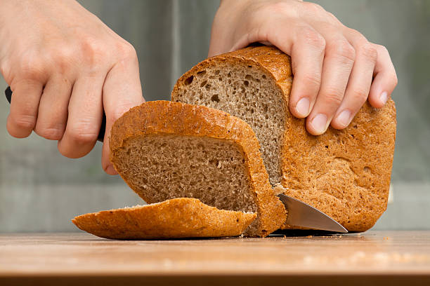 istock cutting a loaf of bread 498253392