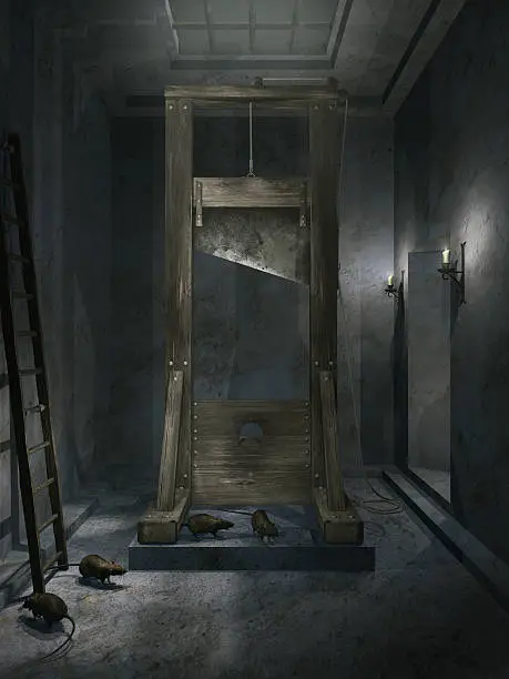 Old dusty room with guillotine and rats